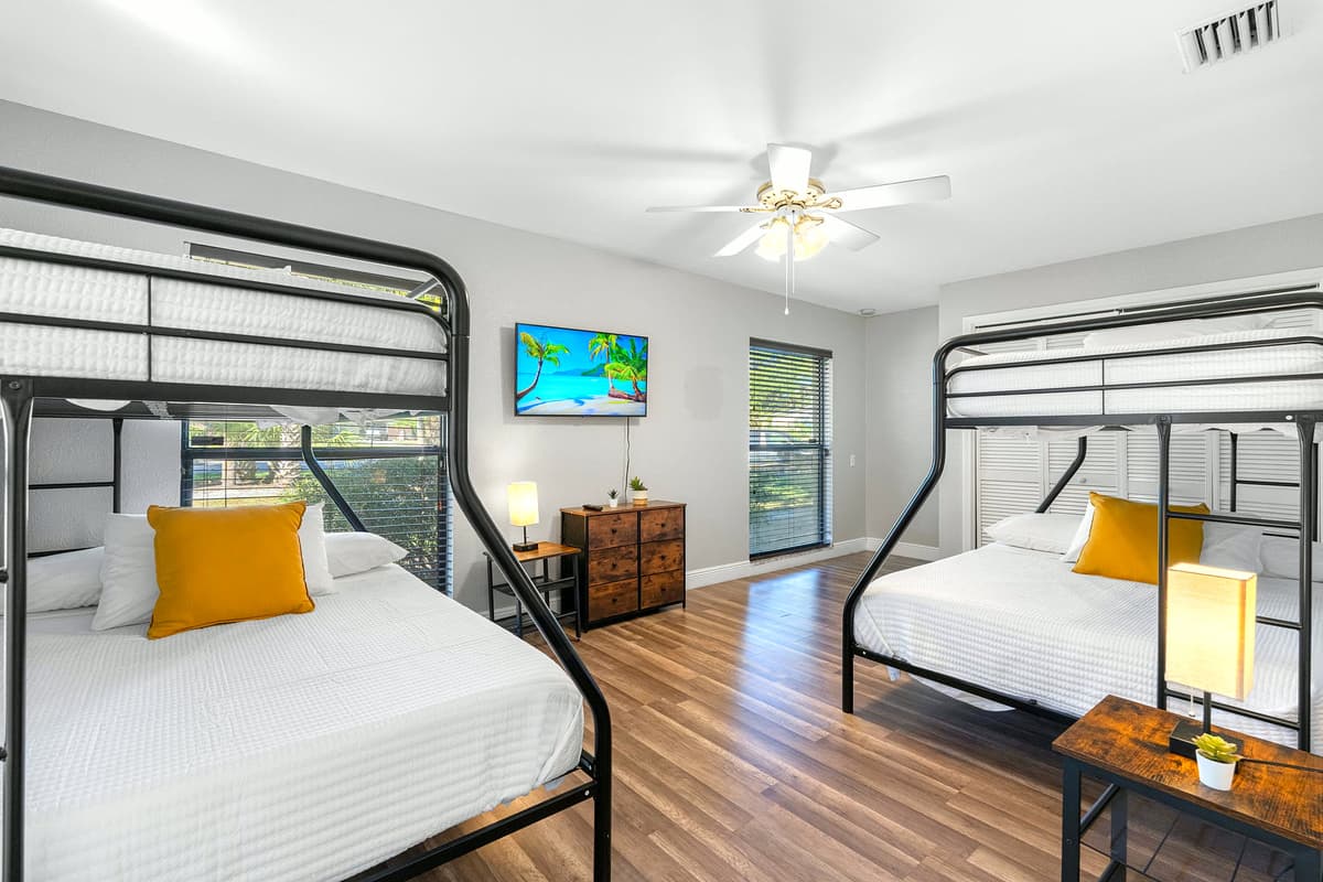 Ideal for families or groups, this roomy setup features two twin-over-full bunk beds for ultimate comfort.