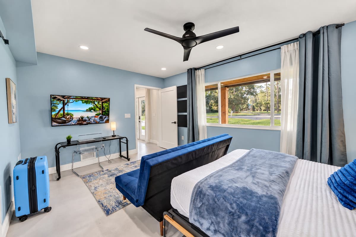 The room that lets a couple bring the extra guest without anyone drawing straws for the sofa.