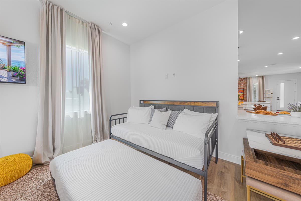 Cozy room with soft lighting, plush bedding, and a calming atmosphere for restful nights.