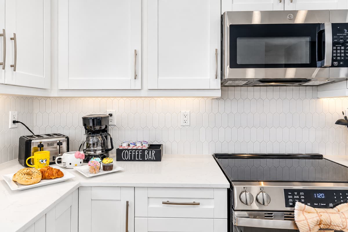 Fully equipped kitchen with stainless steel appliances and coffee station for your mornings.