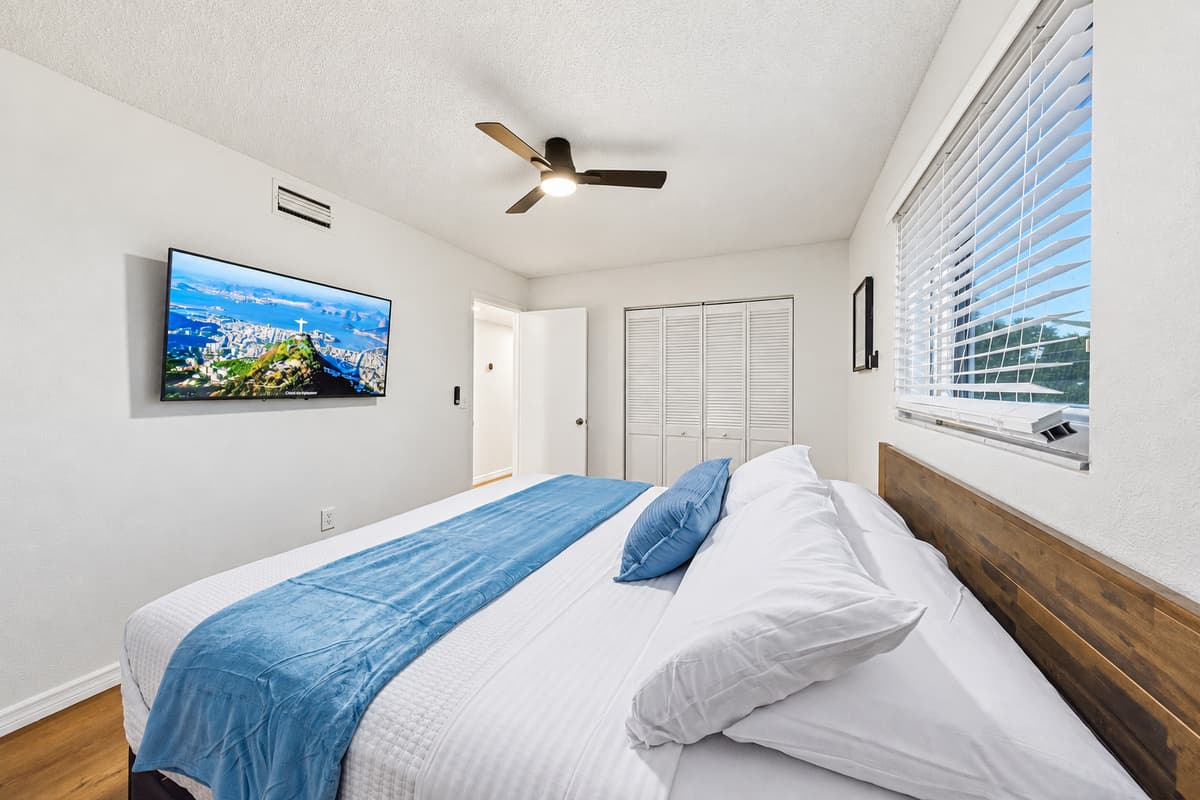 Clean and modern king bedroom with minimalist design and calming neutral palette 