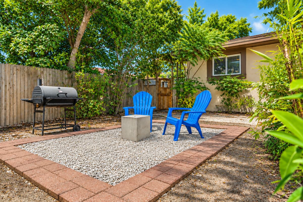 Inviting outdoor patio space perfect for grilling, relaxing, and enjoying the quiet backyard setting.