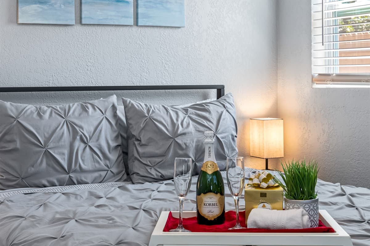 The décor of the bedroom is both refined and welcoming, with subtle accents that add a touch of sophistication to the space.