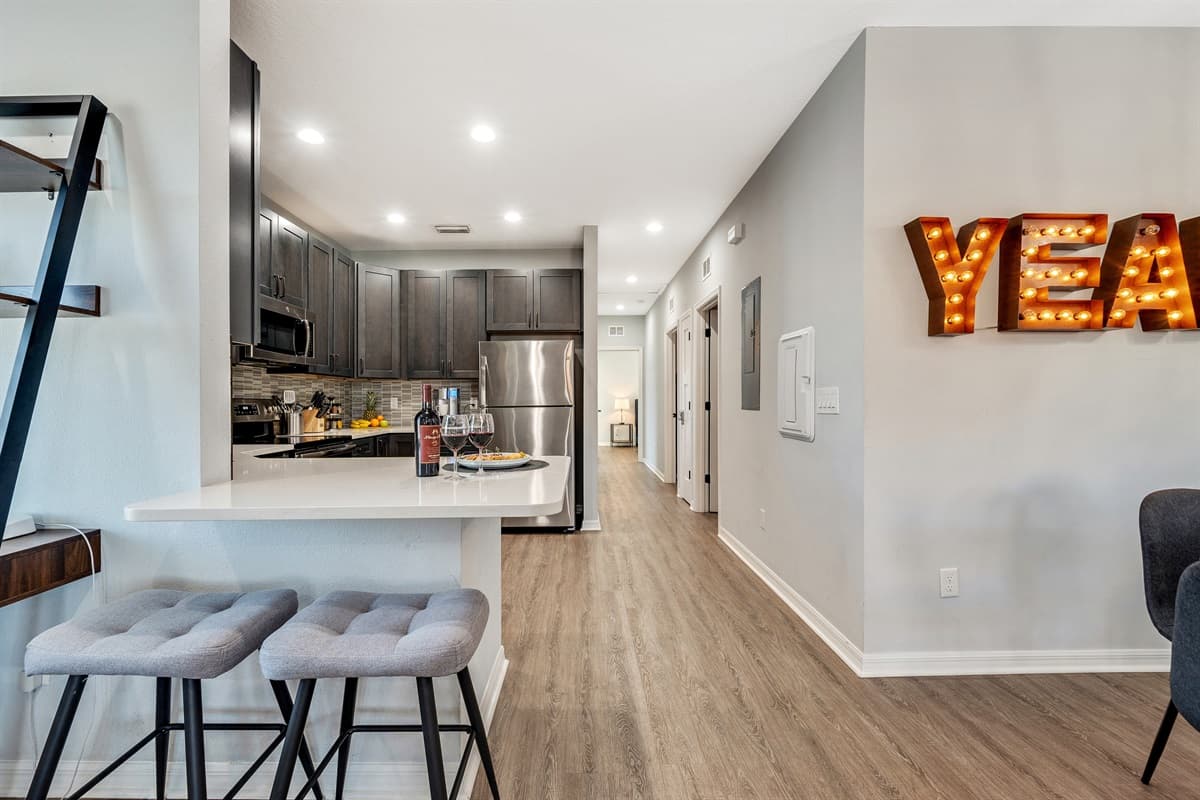 The kitchen stands as the heart of the home, a spacious retreat boasting a contemporary design and an array of modern conveniences. 