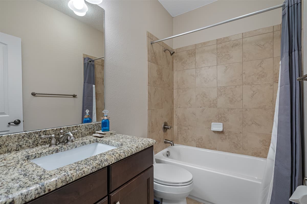 Spacious bathroom equipped with bathtub, sink, toilet and shower. Enjoy a relaxing bath after a long day of travel from your home to your home away from home. If you think this property if for you, send us an inquiry right away!