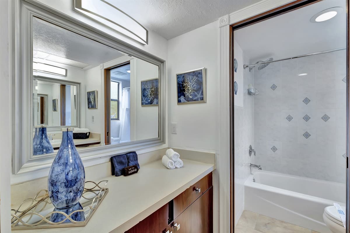 The bathroom is equipped with modern fixtures and finishes, including a spacious walk-in shower or a luxurious bathtub, perfect for relaxing soaks.