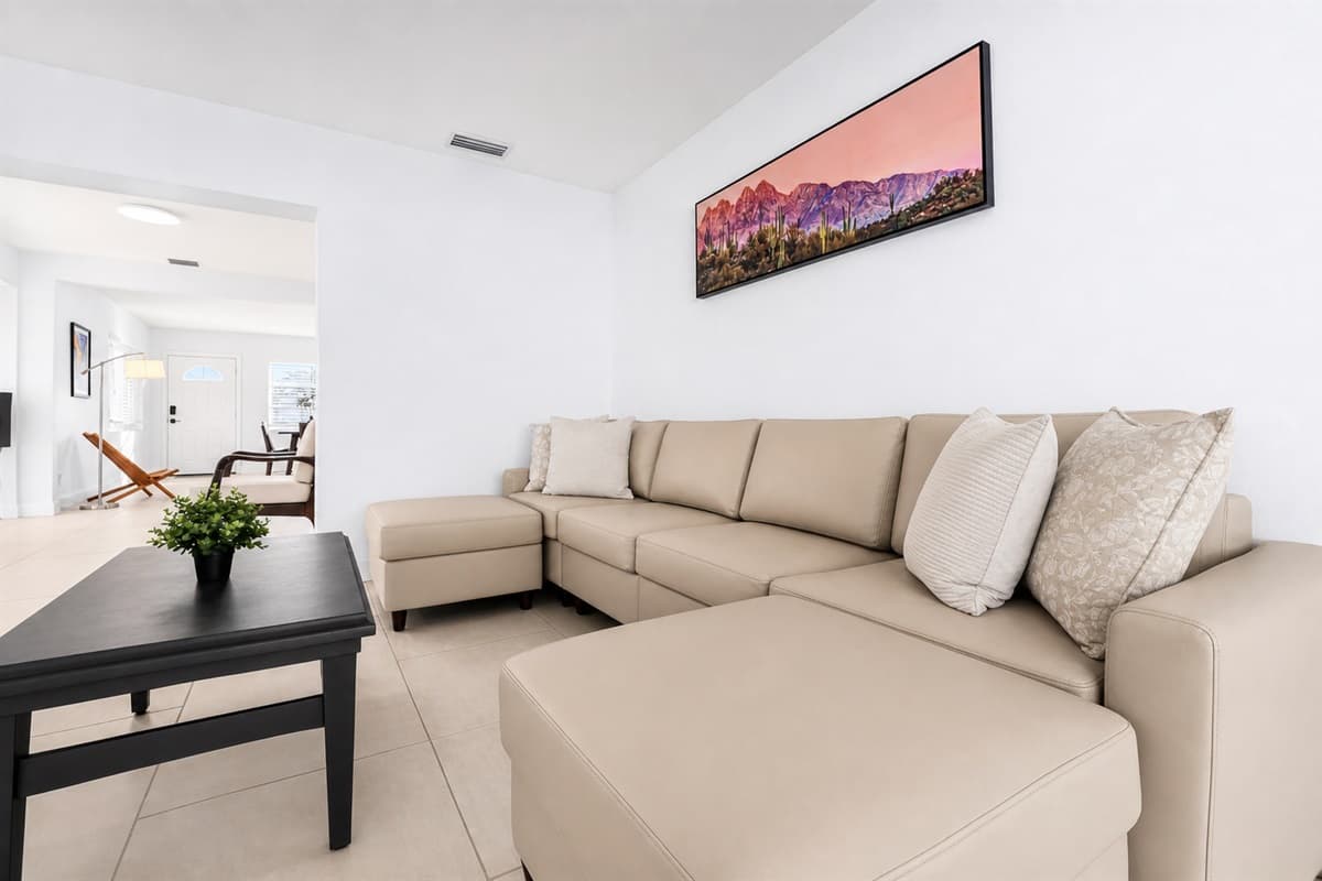 Stylish lounge space featuring plush sectional seating and bright contemporary design.