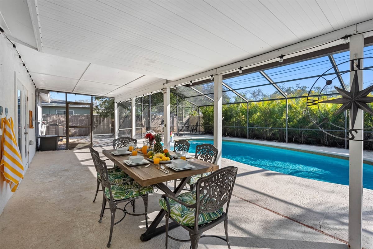 The outdoor poolside dining area is thoughtfully positioned for easy access and great views of the pool, enhancing the experience of every meal.