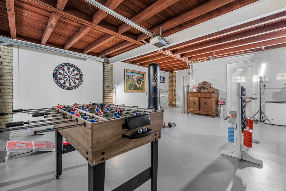 Designed for play and laughter, this game room offers a variety of games and wide-open space to spread out and enjoy.