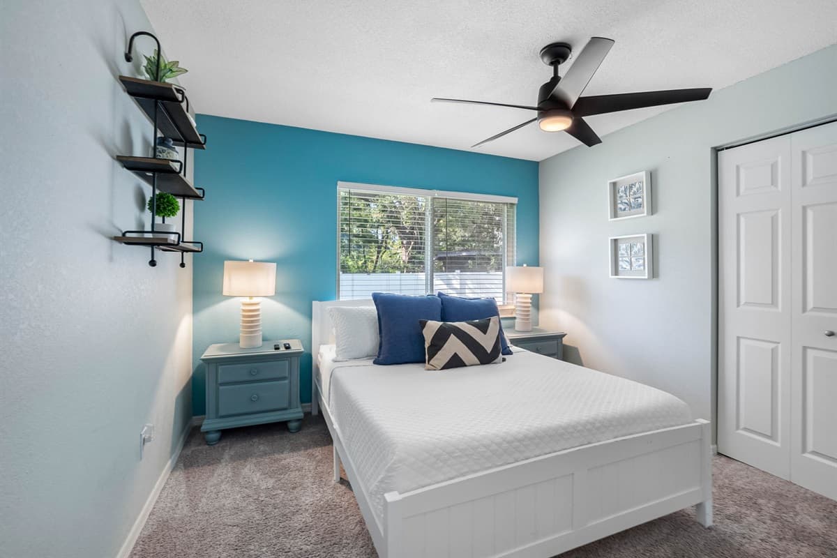 A soft, inviting queen room where modern design meets coastal charm — perfect for unwinding in comfort.