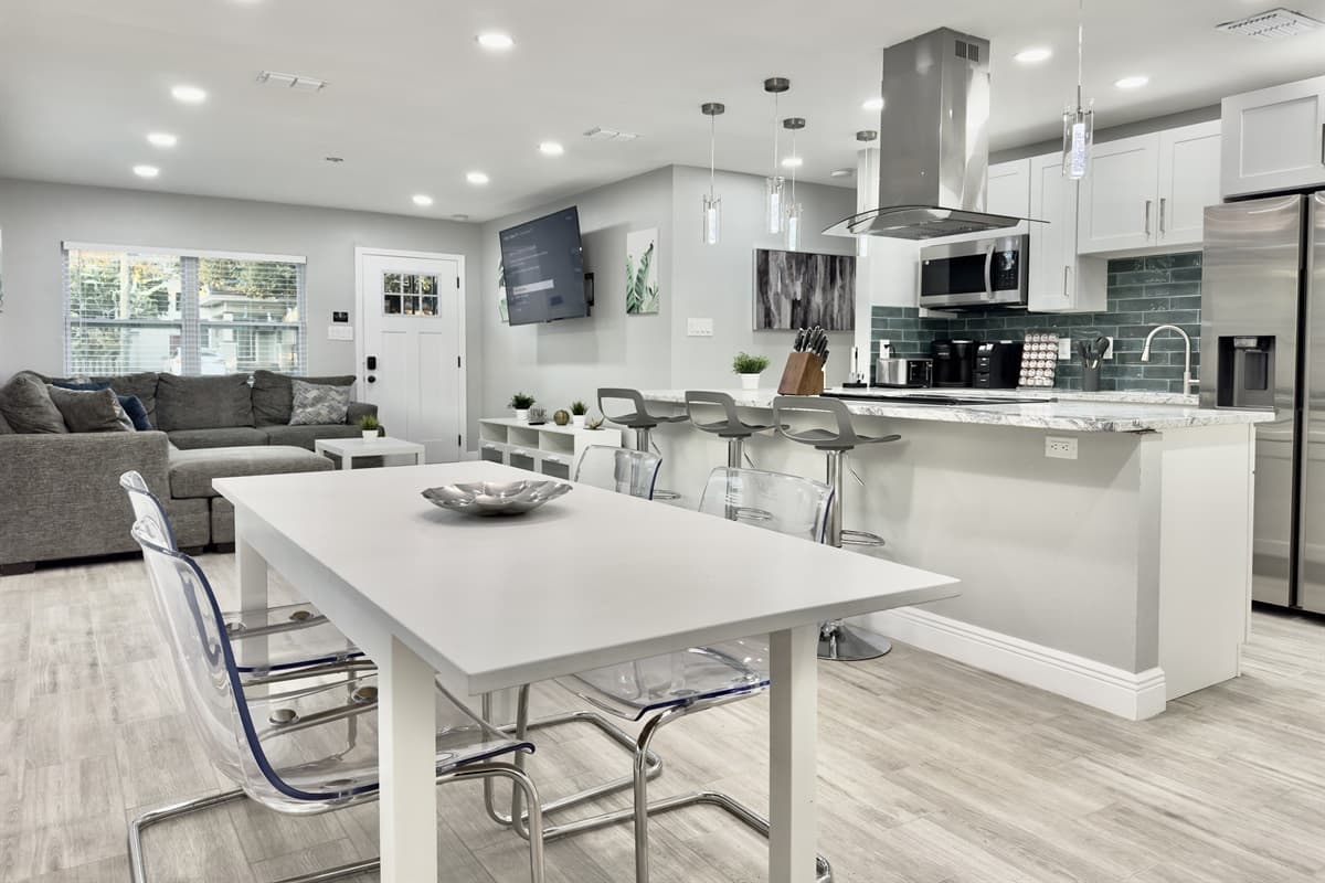 The dining table comfortably seats 4 guests, offering the perfect spot for everything from a hearty breakfast to an intimate dinner.