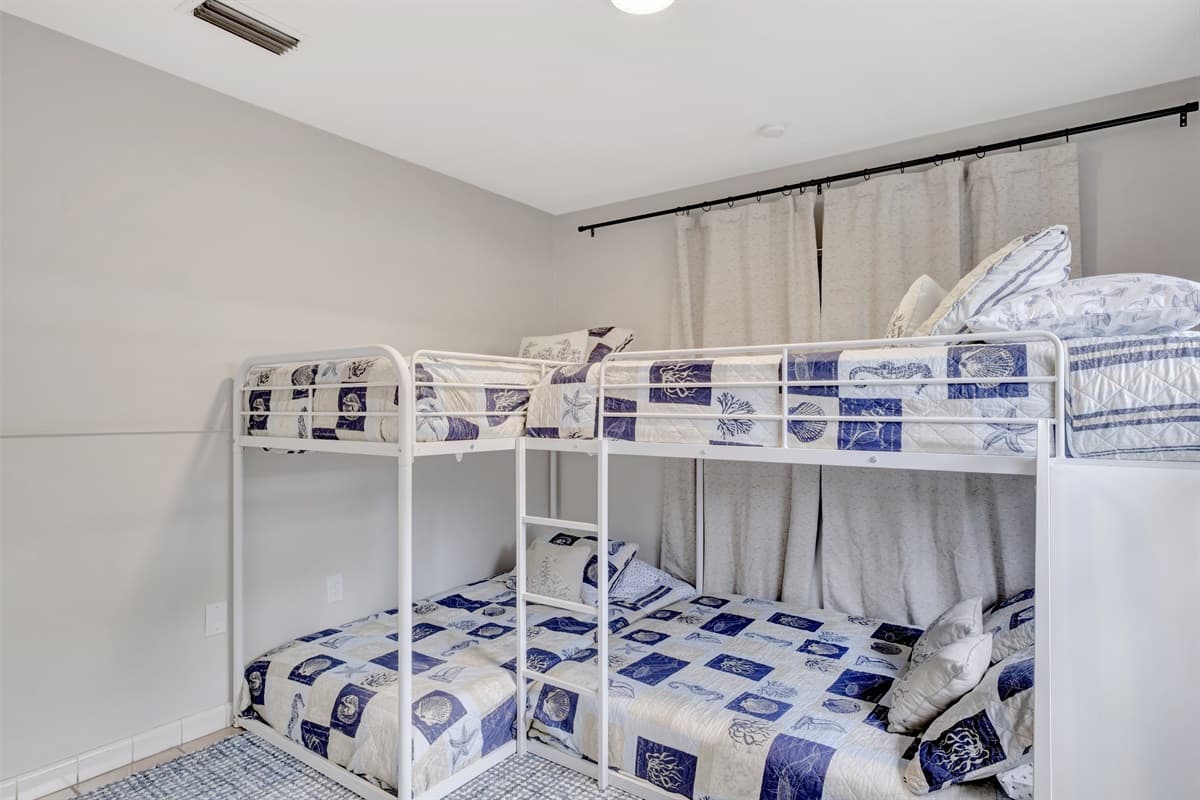 Our bedroom is a delightful space where imagination takes flight, featuring not one but two whimsical bunk beds that invite adventurous dreams.