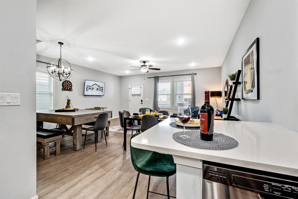 As you move through the kitchen, you'll discover an inviting dining area, seamlessly connected to the cooking space.