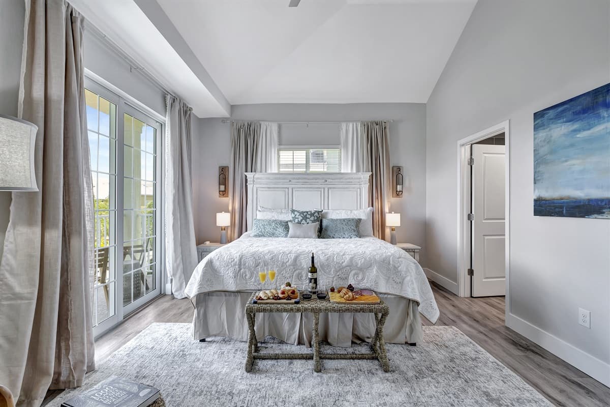 Elegant master bedroom adorned with a king-size bed, veranda access, and a luxurious ensuite bathroom.