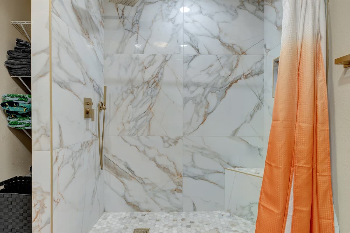 Our beautiful bathroom - Opulence meets tranquility with its elegant cream, marble, and gold theme.