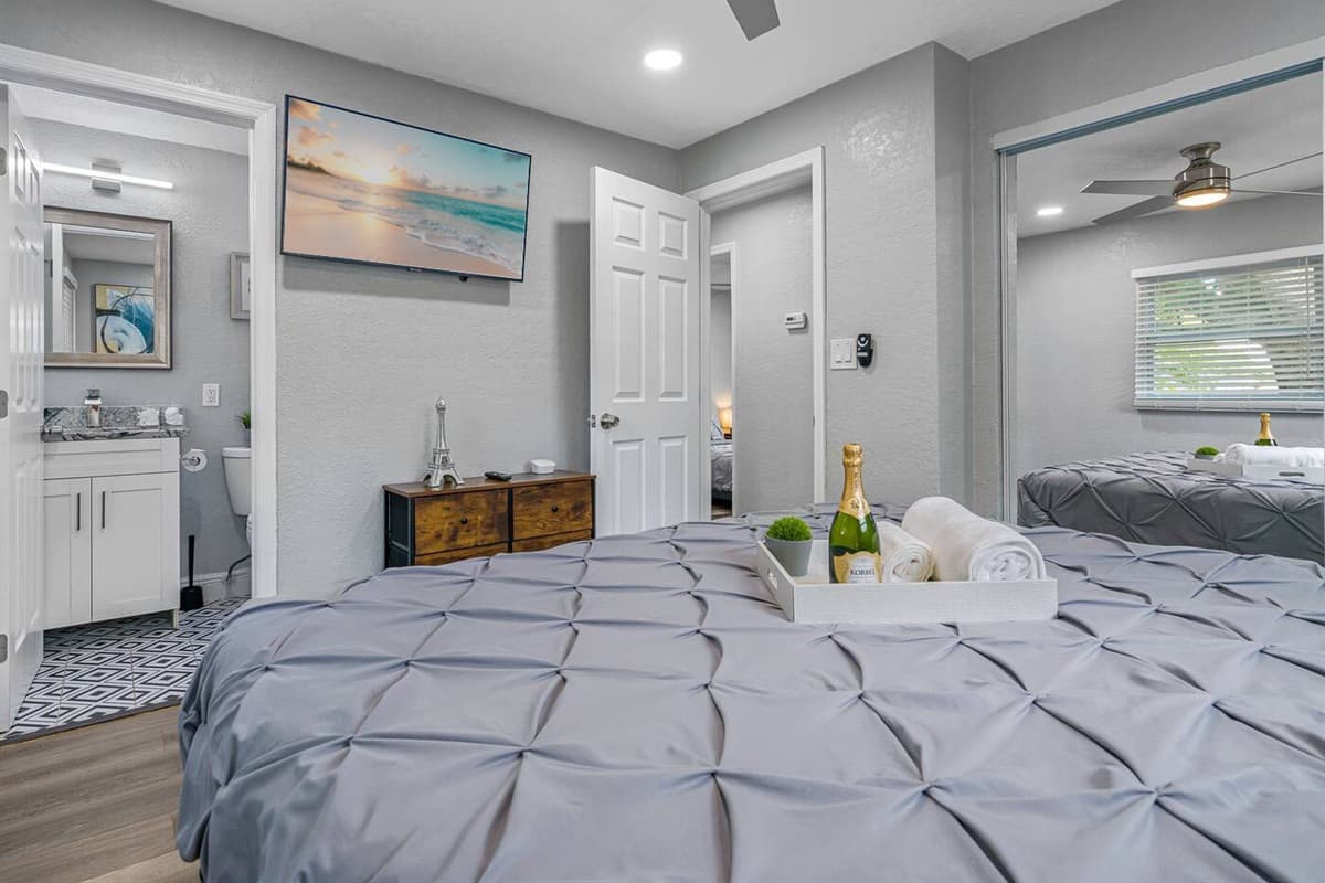 Lovely bedroom that has comfy queen sized bed, its own bathrrom, drawers and closet for storage and smart TV. Sleep safe and sound during your stay this wonderful house!