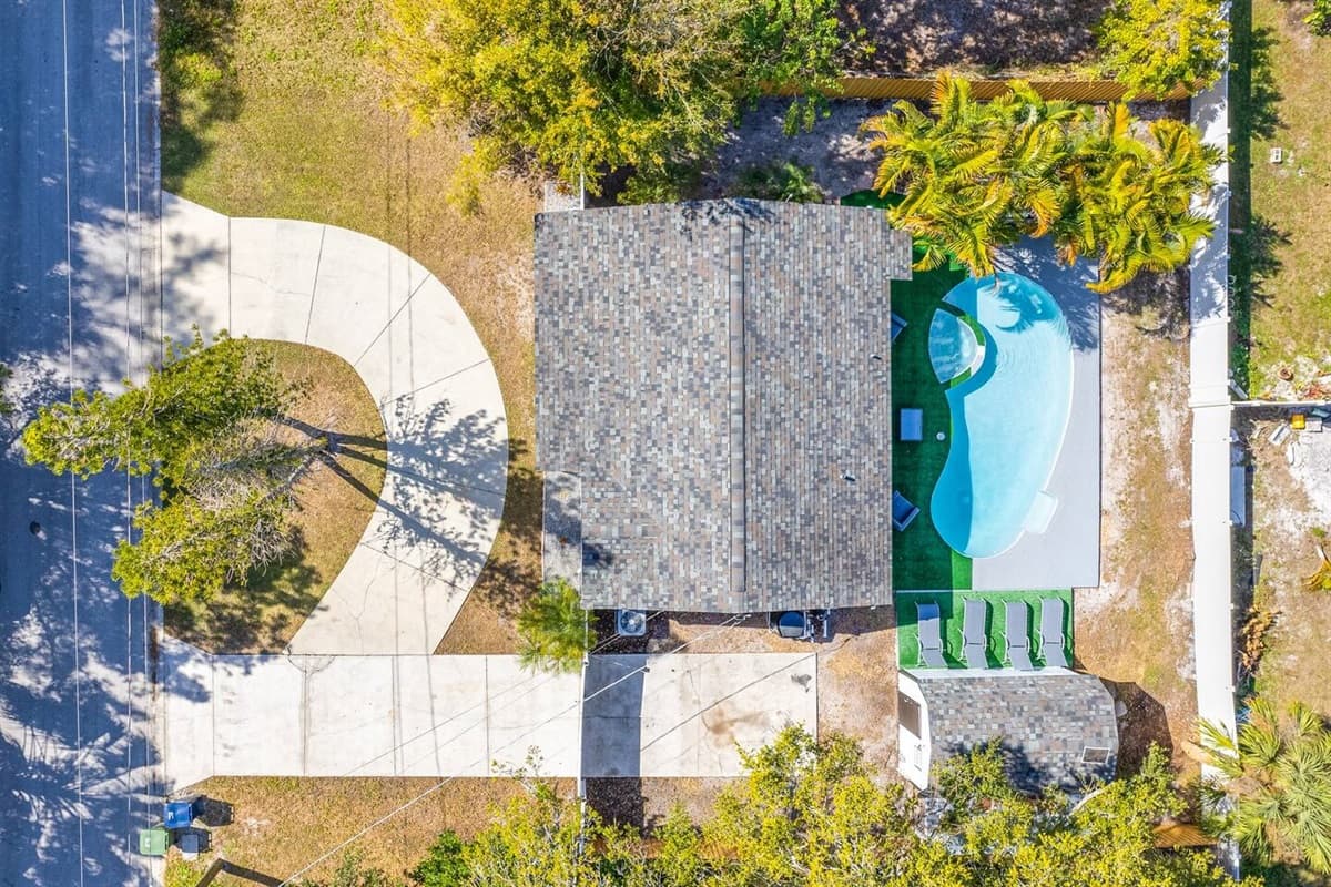 Aerial top view of our beautiful property and the stunning surroundings. Enjoy the view outside showcasing beautiful properties in the area. If you like this property, please send us an inquiry right away!