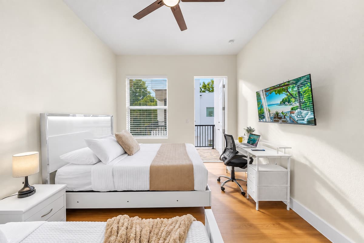 Stylish bedroom with modern décor, workspace, and relaxing ambiance.