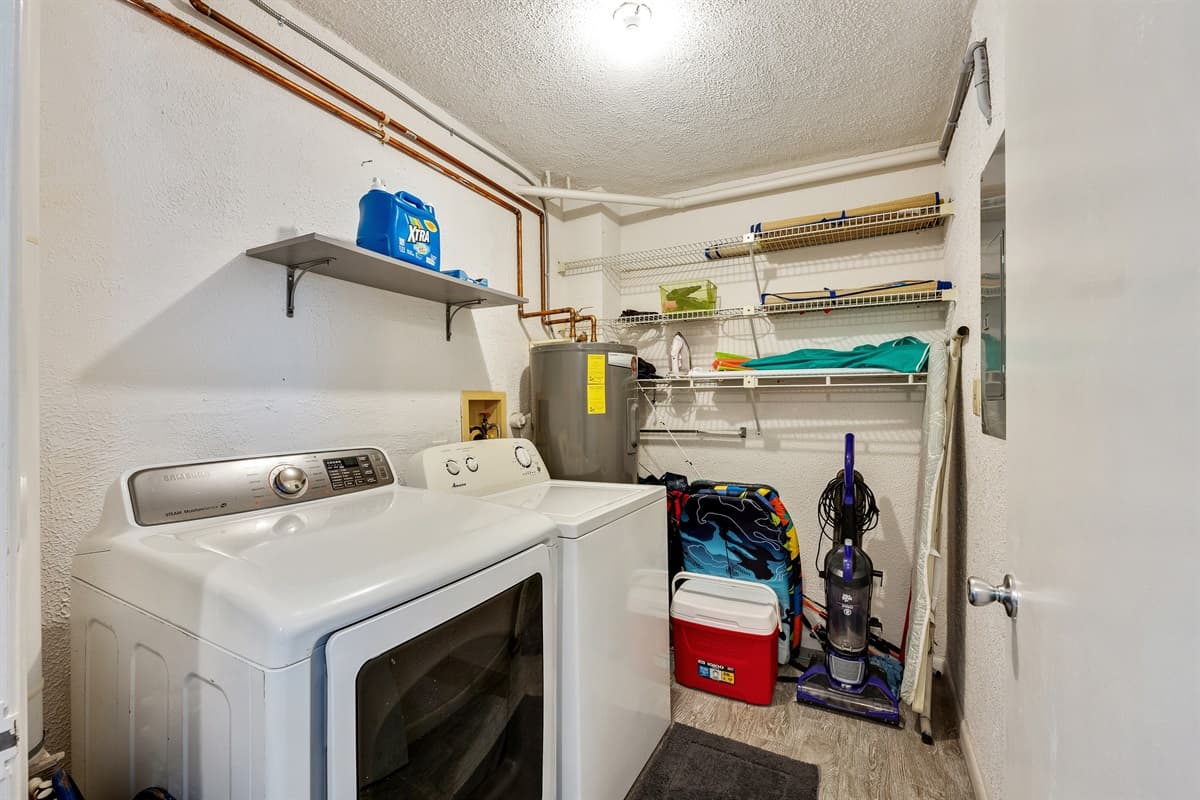 The laundry area is equipped with a washer and dryer, allowing you to conveniently launder your clothes whenever necessary.