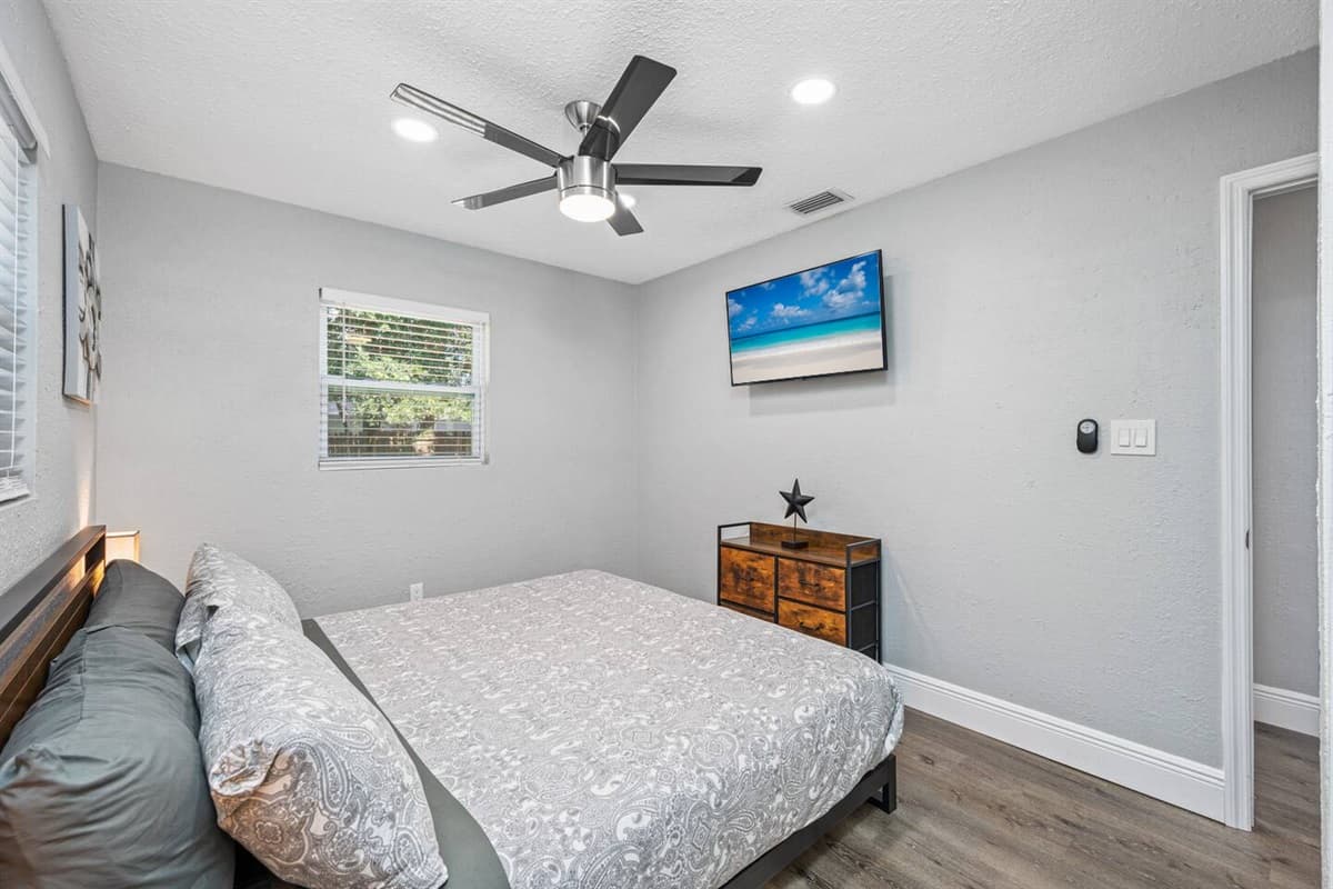 Sleep safe and sound on the comfort of your home away from home. This comfortable bedroom has a queen sized bed, smart TV and drawers for storage!