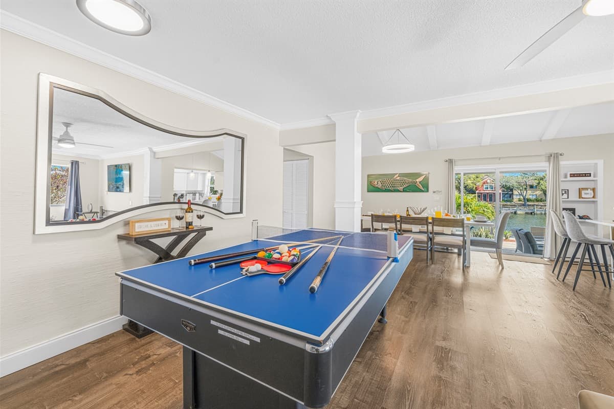 Game room with pool table overlooking the dining area—great for entertaining all ages.