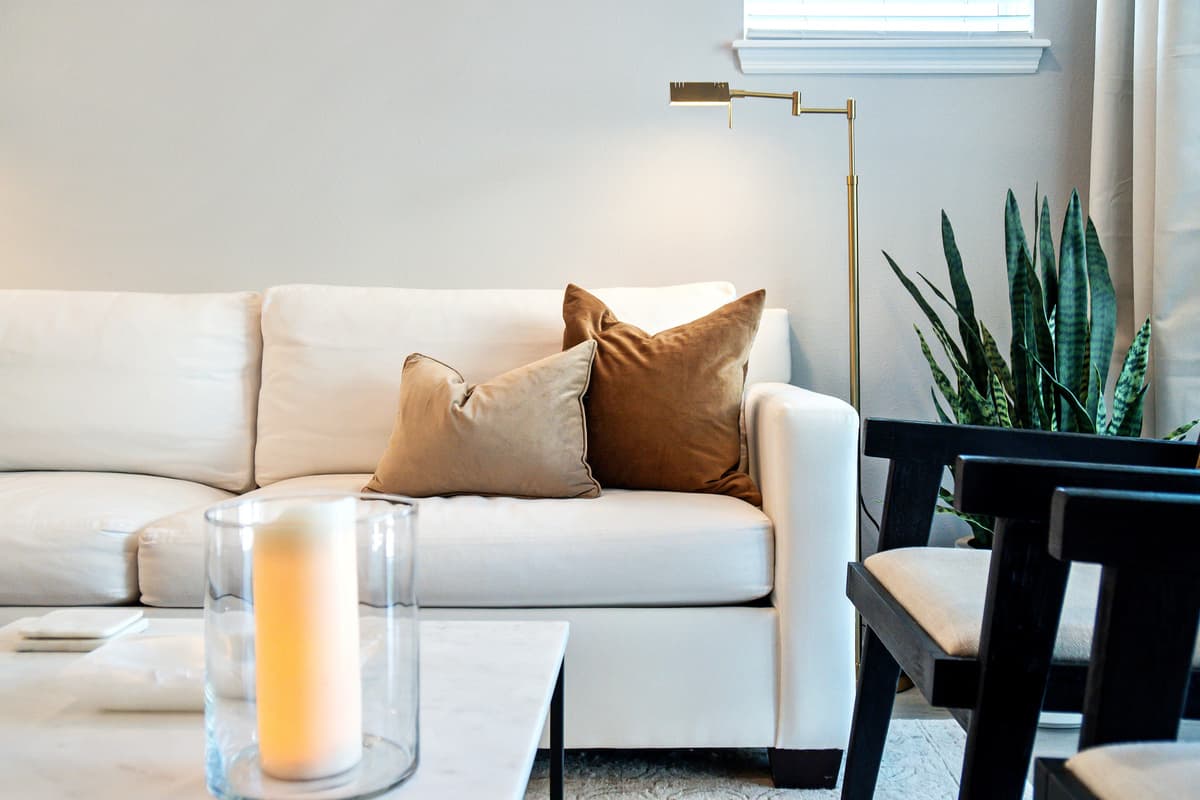 Your gaze drifts across the spacious lounge, taking in the carefully curated selection of plush furnishings arranged with impeccable taste.