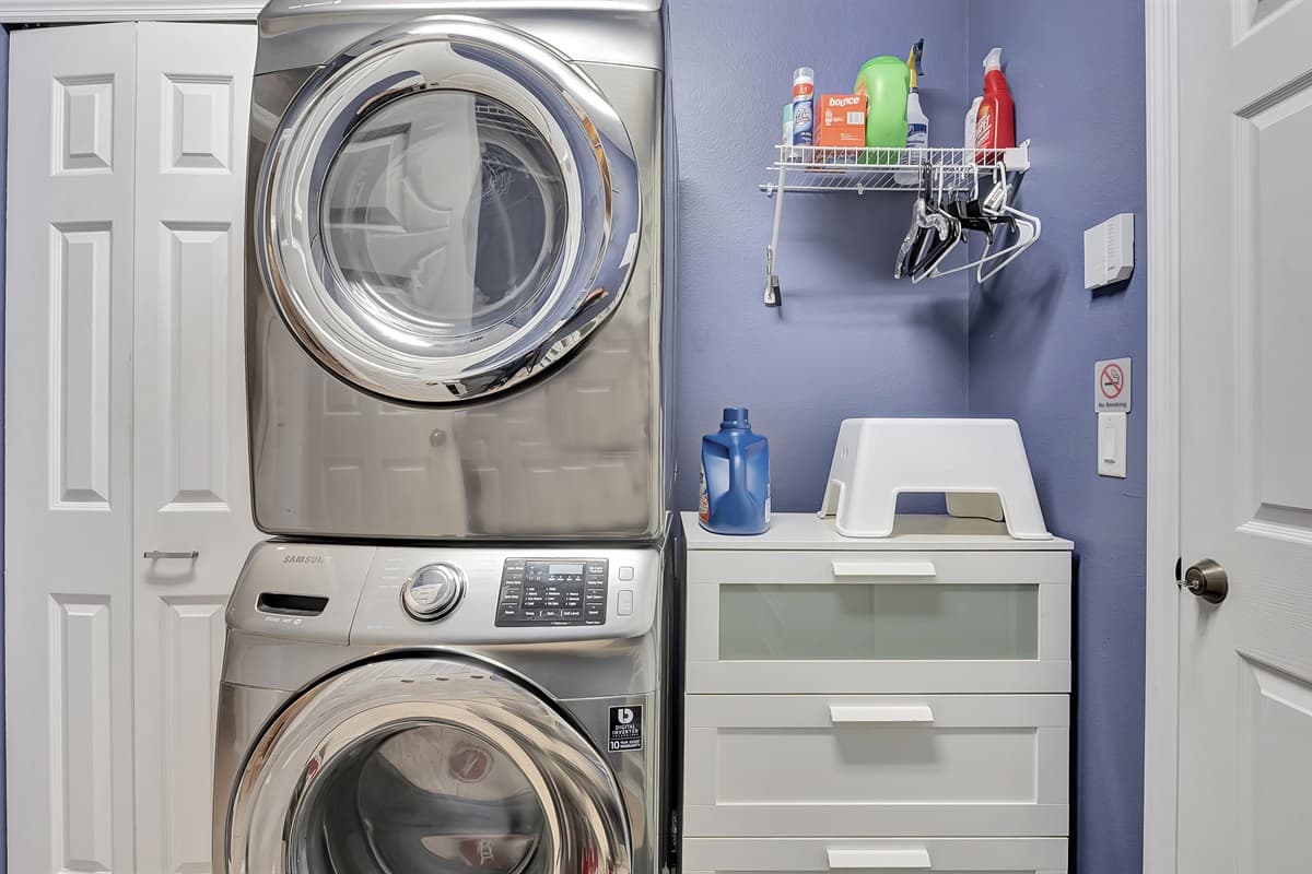 In our laundry room, you'll find a comprehensive set-up, including a full washer and dryer, as well as all the essential laundry supplies you need.