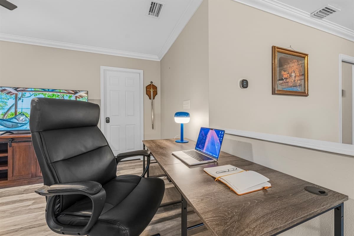 Dedicated workspace with desk, comfortable chair, and open view—perfect for remote work or planning your day.