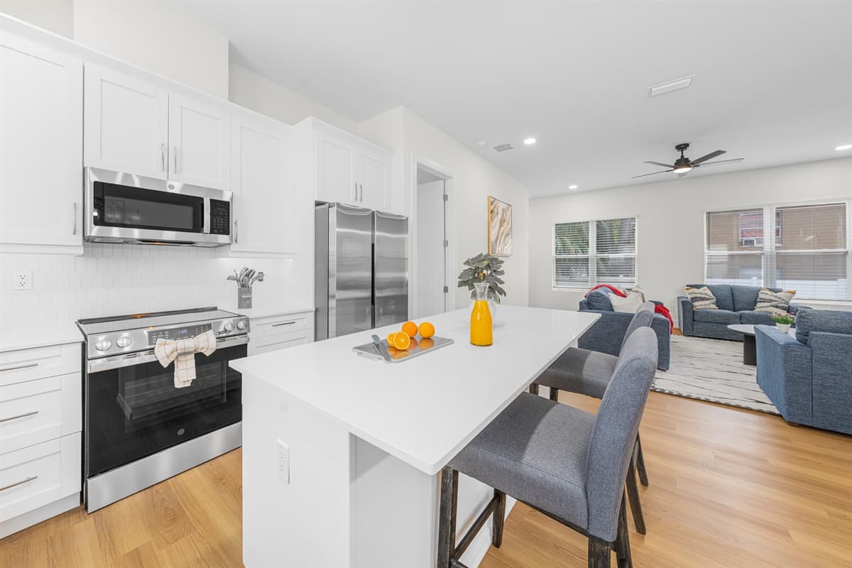 The open kitchen and dining layout keeps everyone connected, whether you're cooking or catching up.