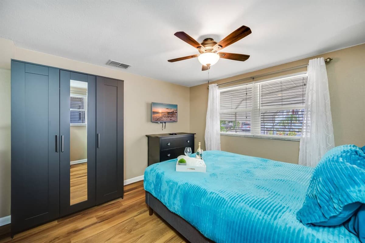 Impeccable bedroom with a queen sized bed, twin bunk bed, closet and a smart TV. Perfect for a group of friends or a family with kids.