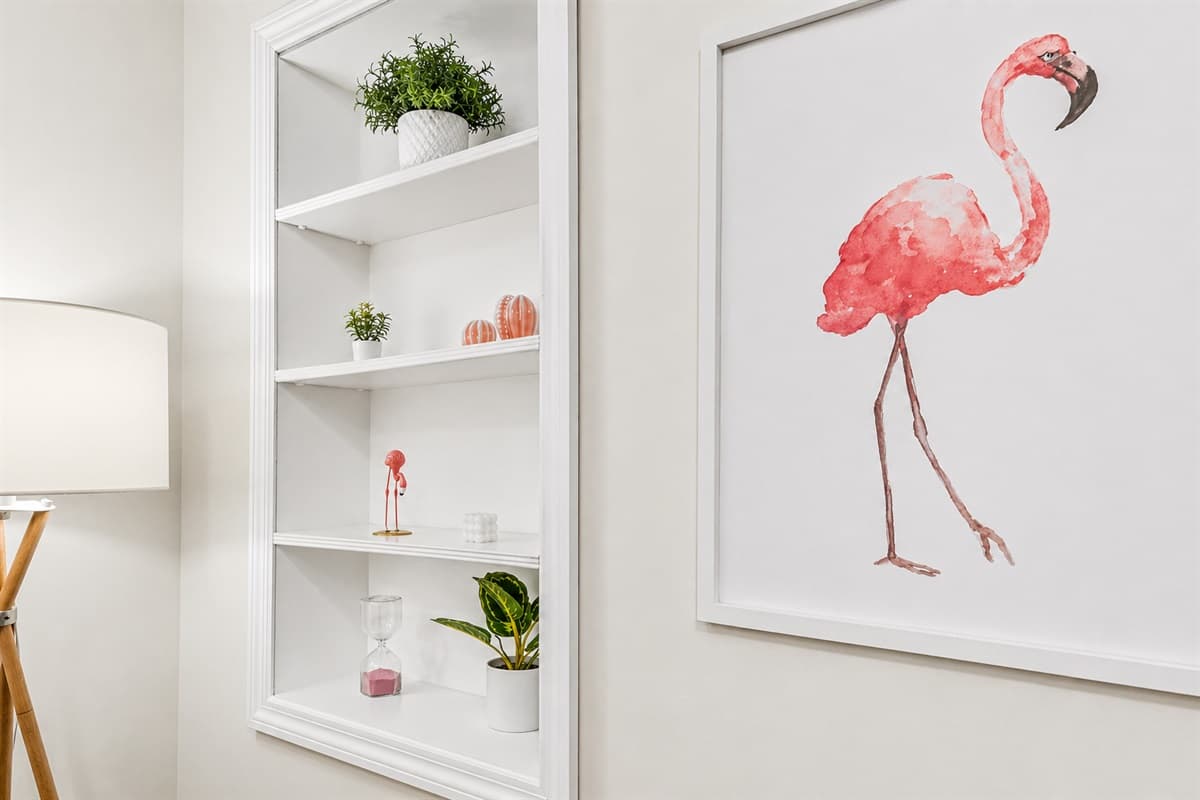 Built-in shelving with tasteful décor adds charm and convenient storage space.