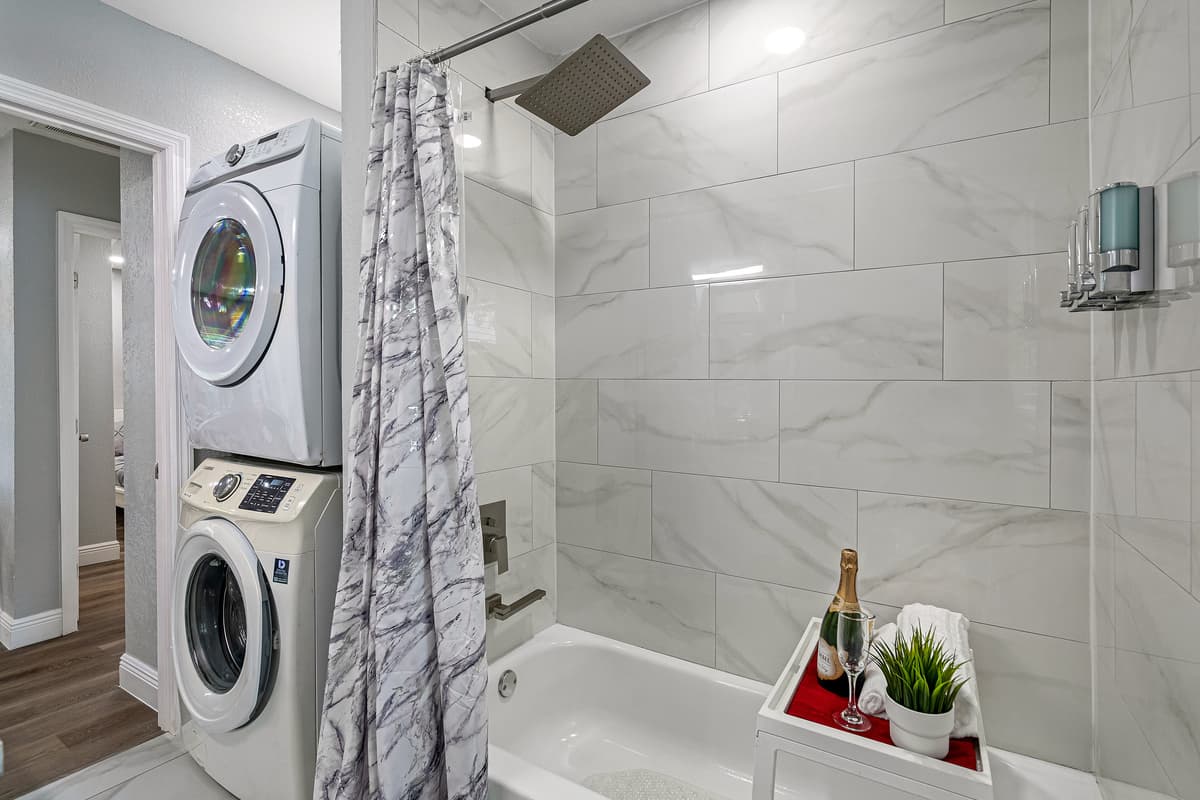 Enjoy a relaxing bath after a long day of travel from your home to your home away from home. Stunning bathroom has his and hers sink, toilet, bathtub and a shower.