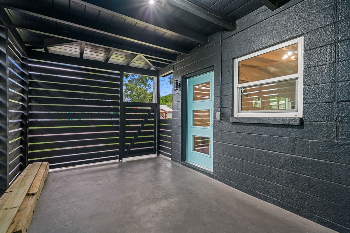 The entryway is a perfect example of this blend, featuring a classic front door with modern hardware.