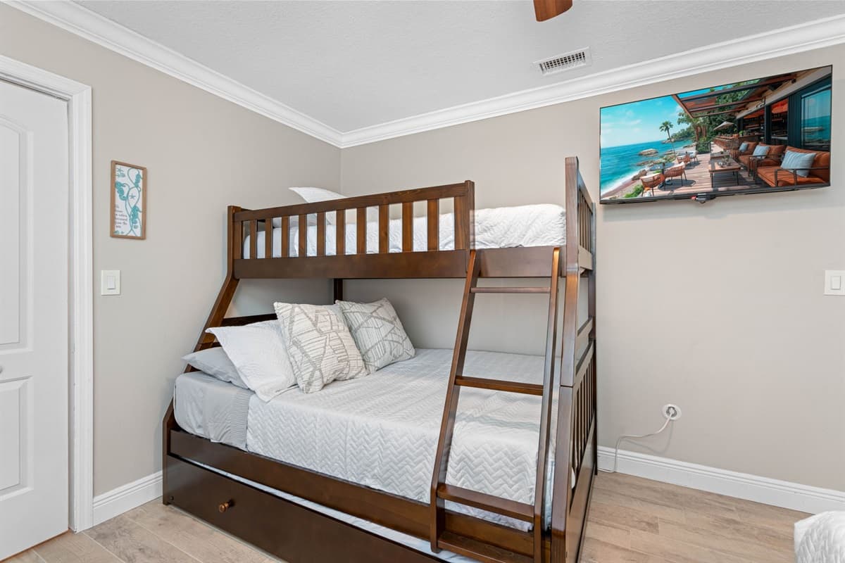The room's layout is thoughtfully planned to maximize comfort and convenience, ensuring ample space for everyone to relax and enjoy their stay.