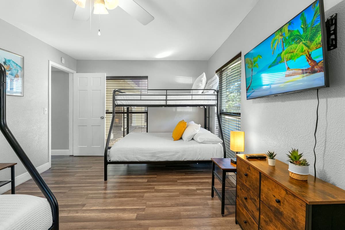 Kids and adults alike will love this cozy, spacious bunk room with a mounted TV.