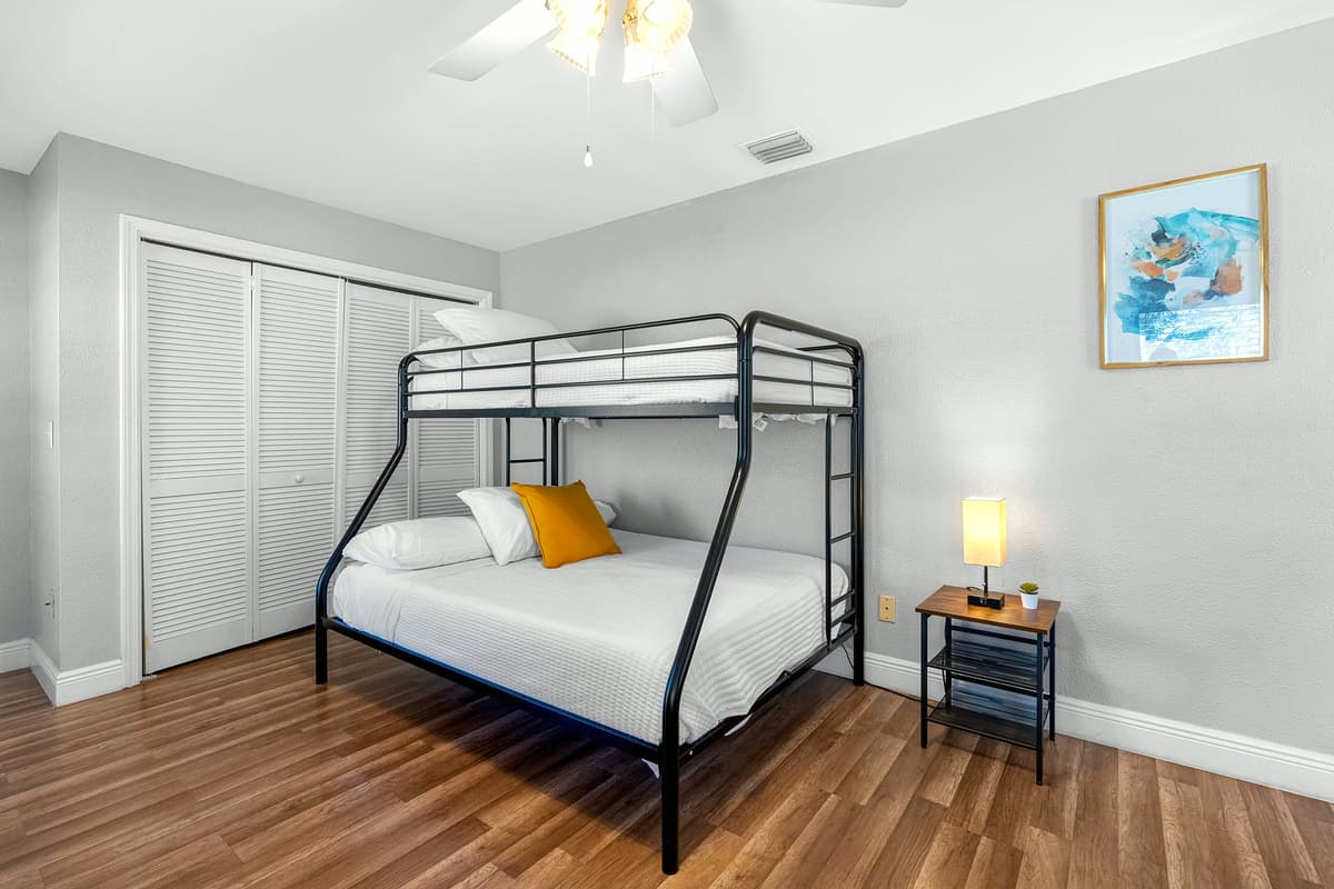 A playful yet practical setup featuring two bunk beds — ideal for large families or friend groups.