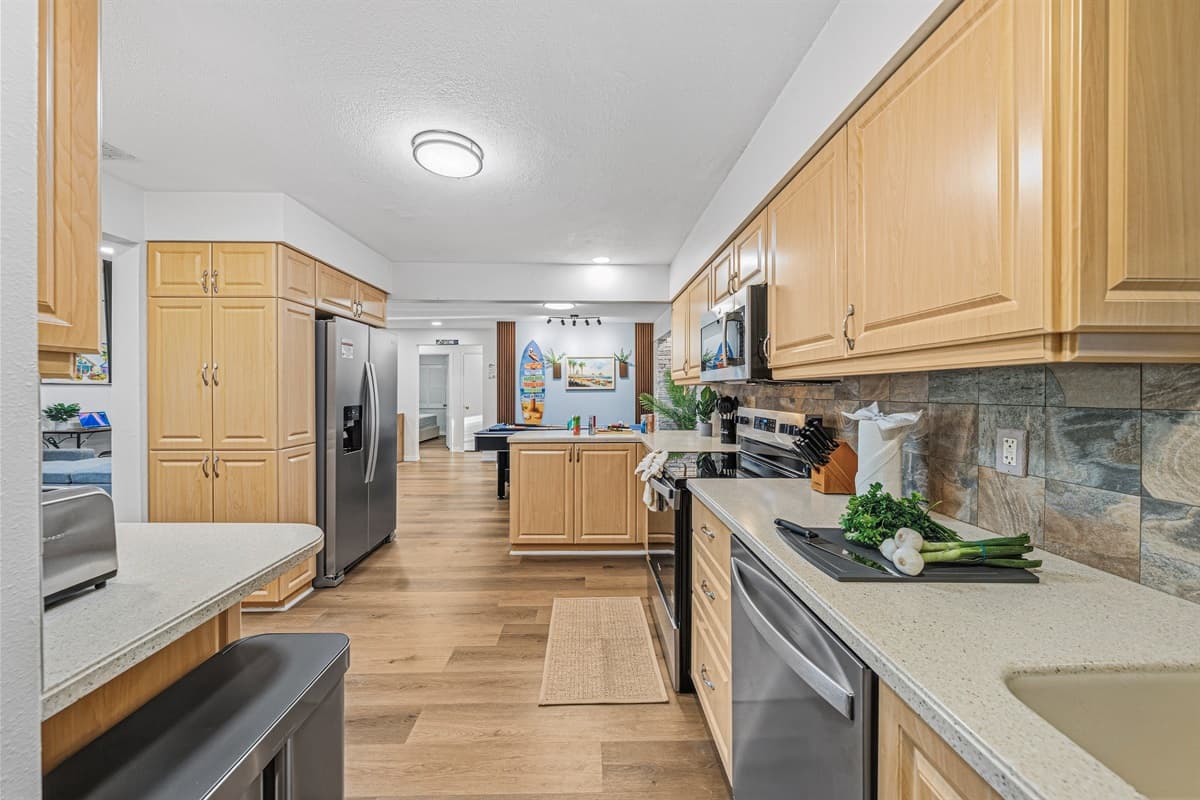 Spacious kitchen with ample counter space and modern appliances—perfect for preparing group meals 