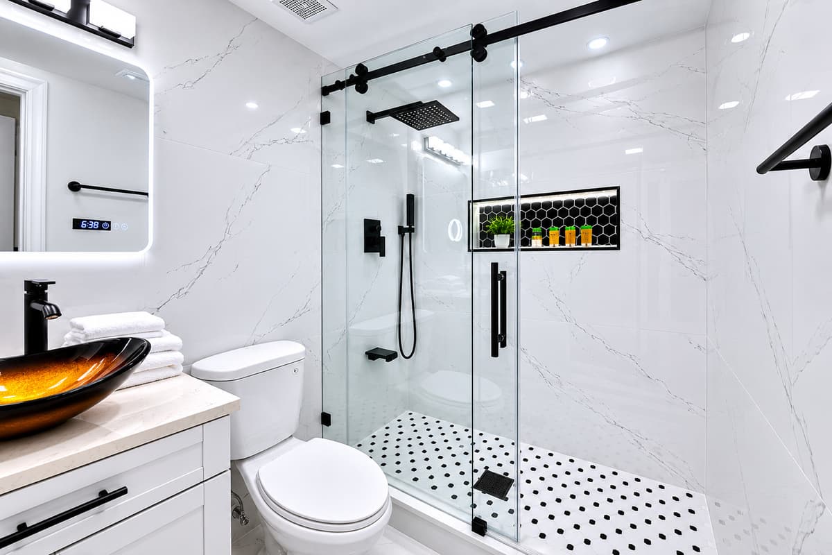 Bedroom 1 - Ensuite
Luxurious primary ensuite showcasing a large walk-in glass shower, modern fixtures, and beautifully updated finishes.