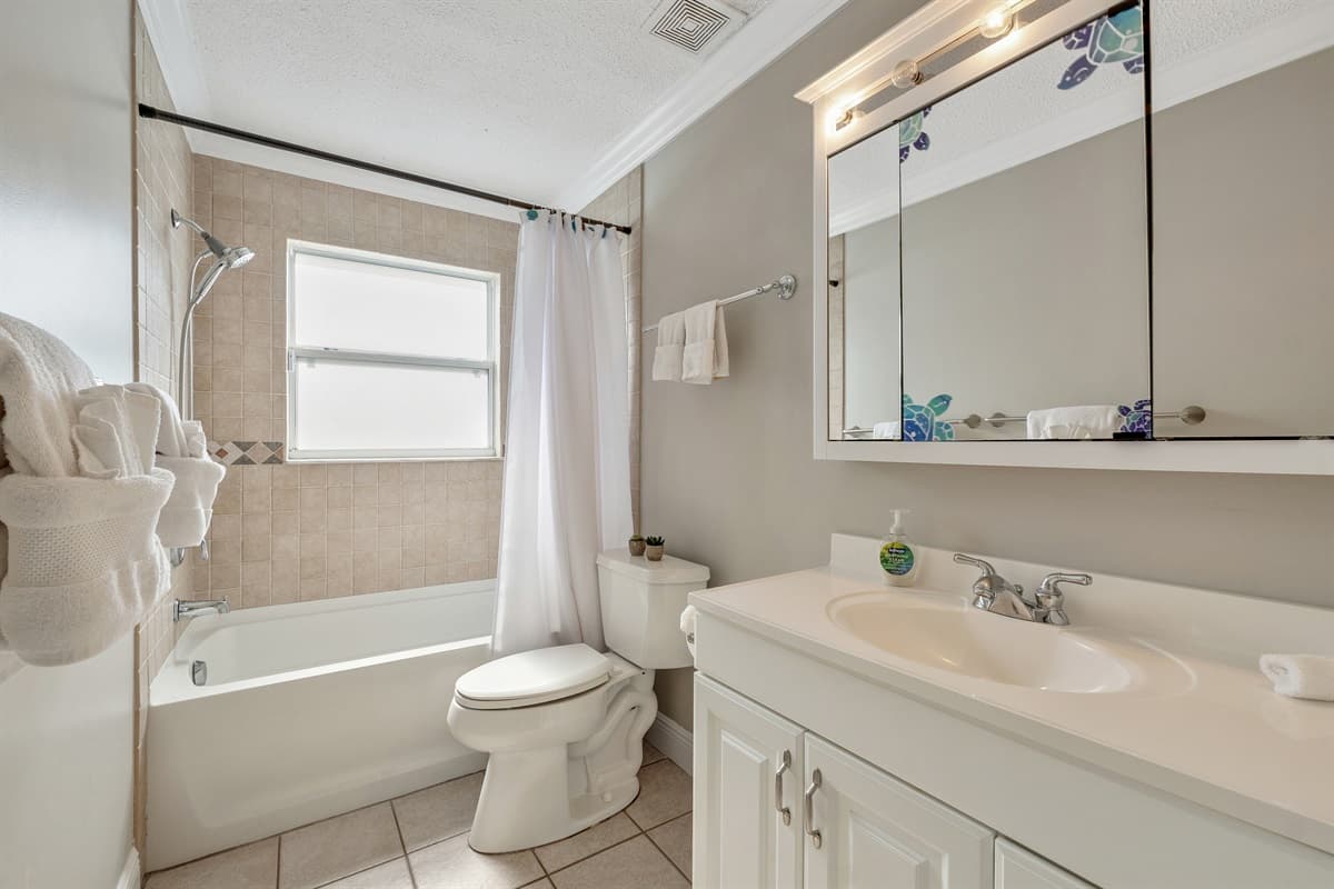 The well-lit and carefully arranged vanity mirror adds a touch of sophistication.