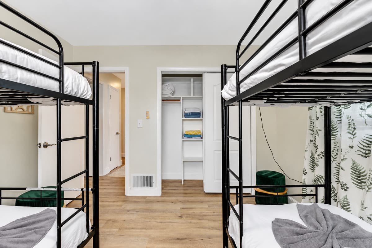 In this bedroom, versatility and thoughtful design converge to create a welcoming environment that adapts to the unique needs of each guest.