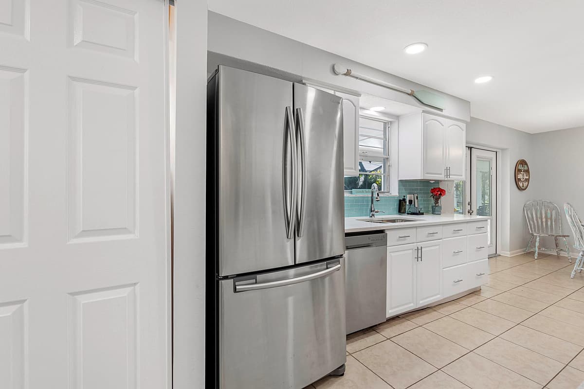 Stocked with essential appliances including a refrigerator, oven, stove, microwave, coffee maker, and more.