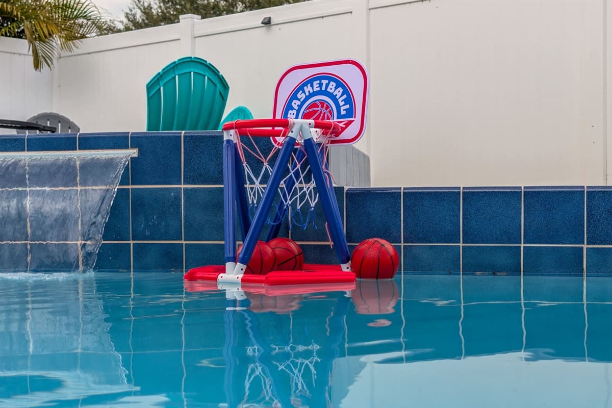 A backyard built for fun and relaxation, complete with a pool, lounging area, and an inviting covered patio for all-day enjoyment.