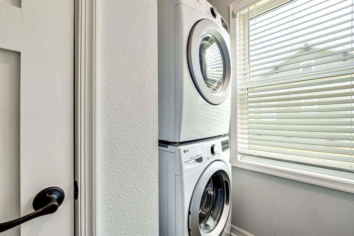 Surrounding the laundry duo are often countertops and workspaces, providing a haven for folding, sorting, and treating stains.
