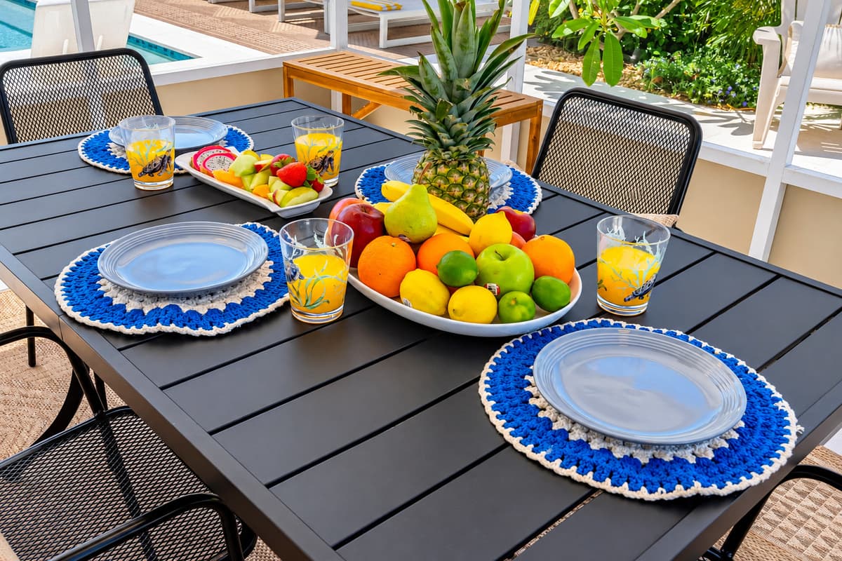 With chic patio furniture, lush greenery, and a crystal-clear heated pool, you won’t want to leave this backyard.