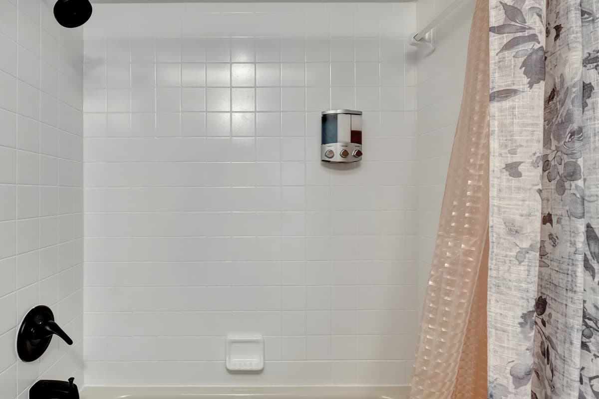 This space offers the perfect blend of functionality with a sleek toilet and a generously spacious walk-in shower.