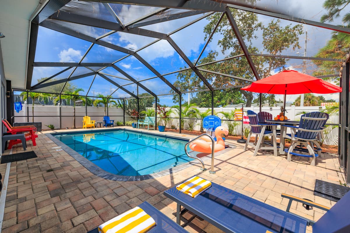 Screened-in pool and outdoor lounge space.