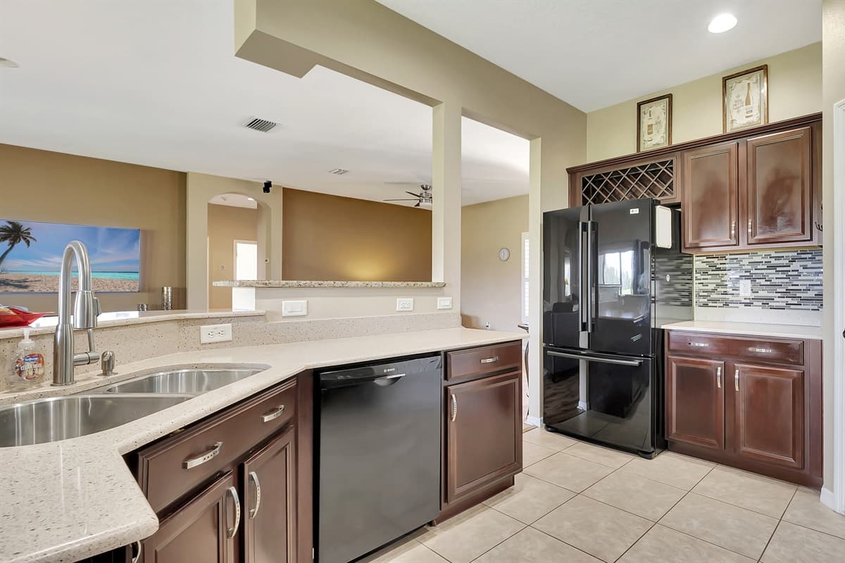 Their rich, warm tones provide a striking contrast to the sleek black appliances, creating a visual feast that delights the senses.