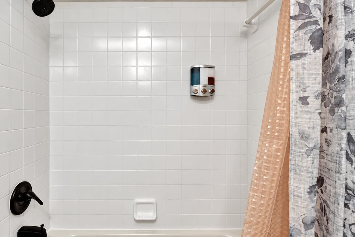 This space offers the perfect blend of functionality with a sleek toilet and a generously spacious walk-in shower.