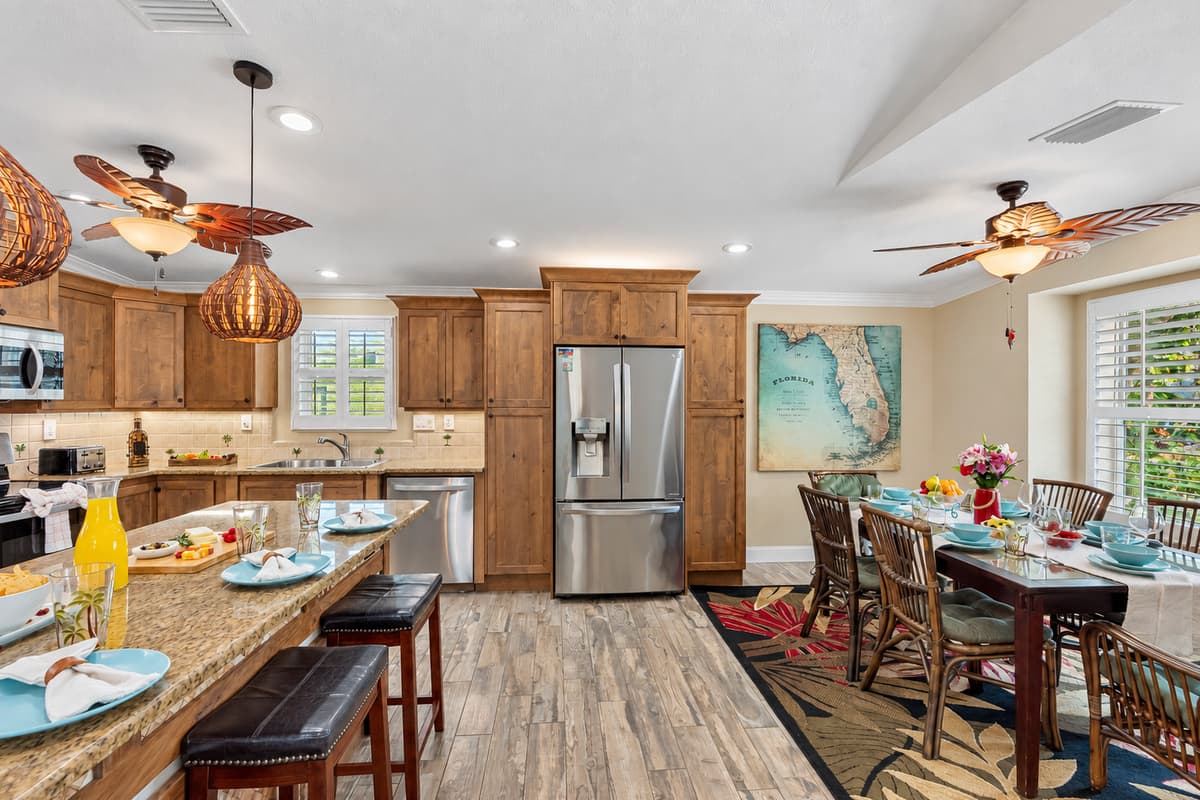 A perfect balance of rustic and modern—wood cabinetry paired with granite counters creates a warm, welcoming cooking environment.