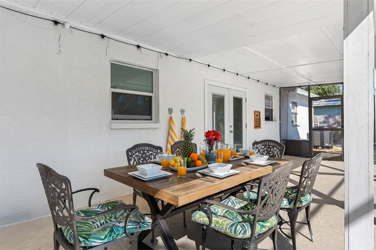 This inviting space offers a spacious dining table with comfortable seating, making it ideal for savoring delicious meals while basking in the fresh air and serene surroundings.